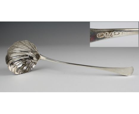 A George III silver shell bowl ladle possibly George Baskerville, London, c.1765 (date mark rubbed), the elongated plain stem