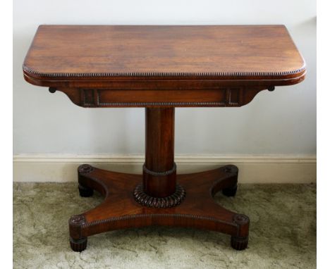 A good William IV rosewood card table the fold-over swivel top with reel moulded border, storage beneath and red baize lining