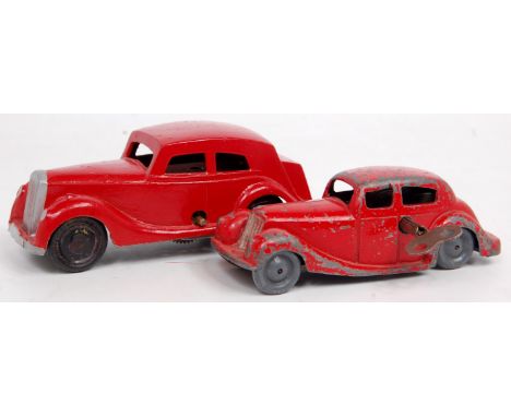 Pocketoy diecast and clockwork saloon, finished in red with grey wheels, with key (FG), sold with a Mettoy repainted diecast 