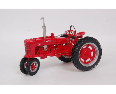 Franklin Mint, 1/12th scale diecast model of a McCormick Farmall model H tractor, red gloss body with red and silver wheels, 