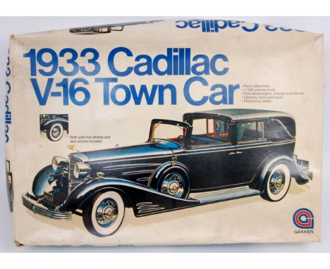 Gakken 1/16th scale plastic kit for a 1933 Cadillac V-16 Town Car, and a AMT plastic 1/12th kit for a 1937 Cord Supercharged 