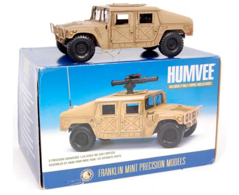 Franklin Mint, 1/24th scale diecast metal replica of a Humvee High Mobility Multi Purpose Wheeled Vehicle, in the original bo