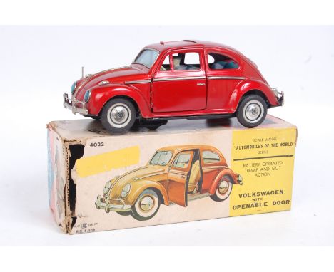 Bandai (Japan) large tinplate Volkswagen Beetle Sedan, battery operated example, metallic red, with tin printed interior, rub