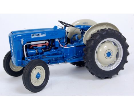 Danbury Mint 1/16th scale diecast metal replica of a 1962 Ford Tractor, finished in blue with grey mud guards, serial number 