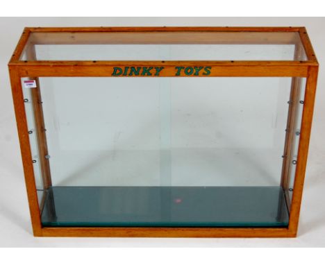 Dinky Toys, glass display case, oak framed with 4 glass shelves, measuring 32" wide x 24" high x 9" deep, with Dinky toys in 