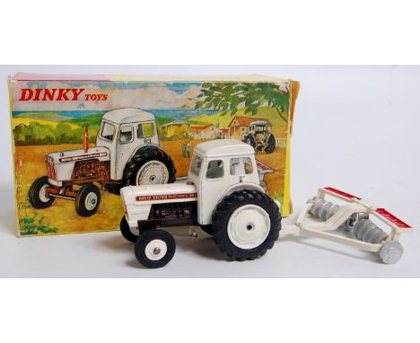 Dinky Toys, No.325 David Brown Tractor with Disc Harrow, white tractor with plastic hubs to front, red exhaust pipe with whit