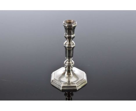 A modern continental silver candlestick, octagonal and 18cm high, marked 835 and weighing 5.55 ozt