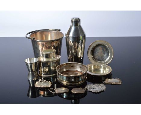 A small group of silver and silver plated drinking related items, including three silver and two silver plated decanter label