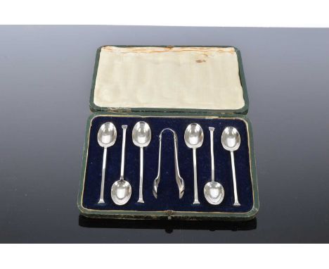 A cased set of six George V silver coffee spoons and sugar tongs