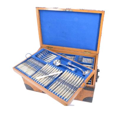 A Fine Harlequin Victorian and later Silver Canteen of Cutlery, retailed by Mappin & Webb, presented in an oak and metal boun