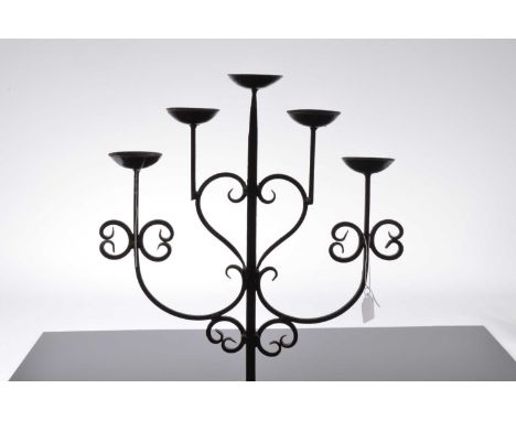 A pair of nice wrought iron floor standing candelabra, 128cm high, each with five sconces and painted black (2)