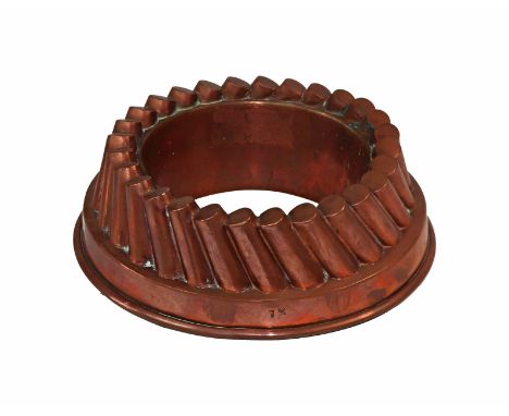 A Victorian copper border mould no. 1½, with twenty-eight slanting cylinders, stepped circular base, suspension ring, 7cm hig