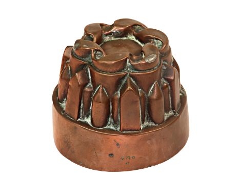 A Victorian copper circular shaped jelly mould, no. 409 C, twisted ribbon top over pointed arch and flute sides, 9cm high, 12