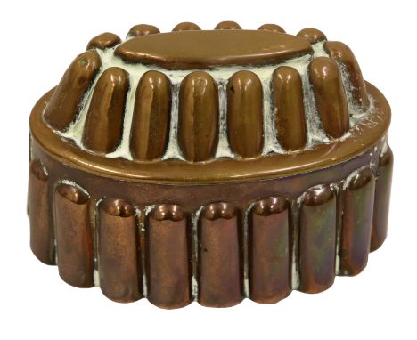 A 19th century copper oval shaped jelly mould no, R H 302, with two rows of finger shaped fluted, 10cm high, 15cm long.