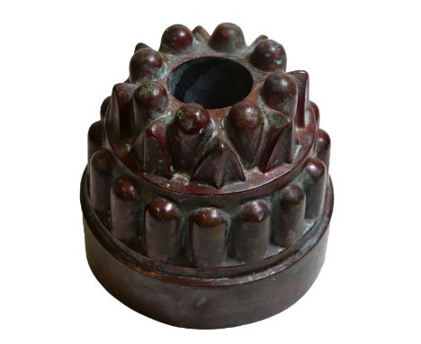 A 19th century French copper circular tiered jelly mould, no. 268, fluted arrow head panels, over a band of half flutes, plai