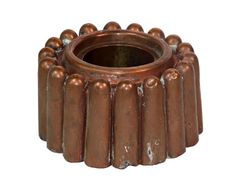 A Victorian copper ring shaped jelly mould, with eighteen tapered flutes, around a raised centre, unmarked, stamped initials 