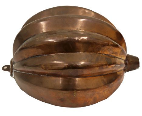 A 19th century French copper jelly mould, in the form of a melon seven lobed fruit with end stalk, suspension ring, unmarked,