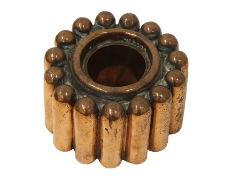 A Victorian copper circular shaped jelly mould, formed as fifteen tapering flutes, raised ring centre, unmarked, 8cm high, 15