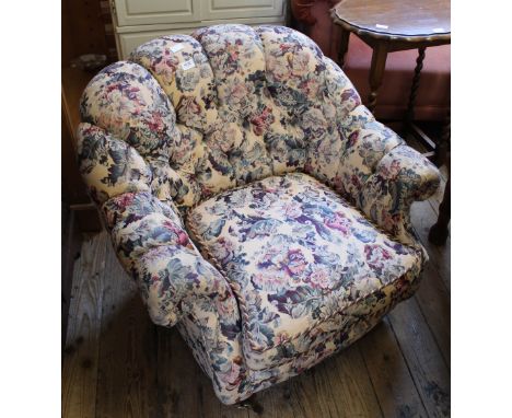A late 20th Century floral button back armchair