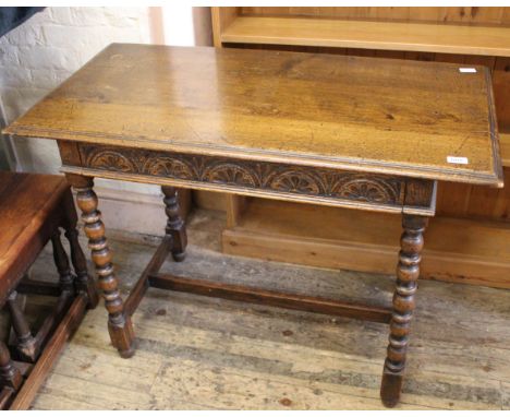 An early 20th Century oak bobbin turned writing table with single drawer