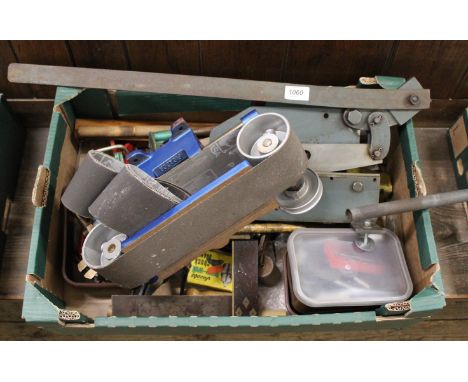 A box of metal working tools including sheet metal cutter