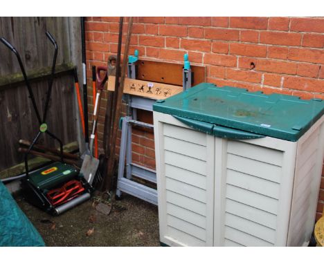 An assortment of gardening tools, Workmate, storage unit etc