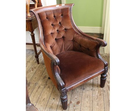 A mid 19th Century mahogany button back armchair