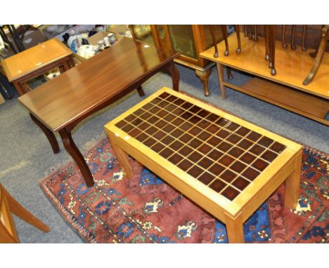 A 20th Century oak coffee table, tile top; 20th century stained mahogany coffee table