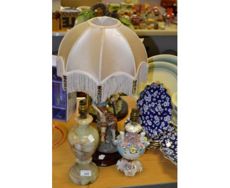 A figural lamp of a courting couple ; other figural lamps (4)