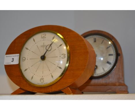 Clocks - a Smiths 30 hour modernist oval mantel clock;  a Coventry Astral domed mantel clock (2)