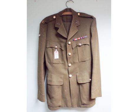 An khaki army tunic to a major in the Royal Tank Regiment complete with medal ribbons
