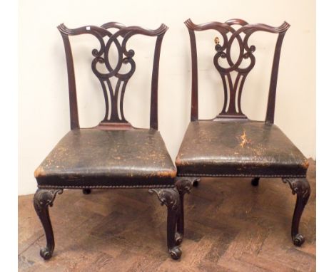 A pair of Chippendale period mahogany dining chairs with curved back legs, front cabriole style legs with ball feet and 23" w