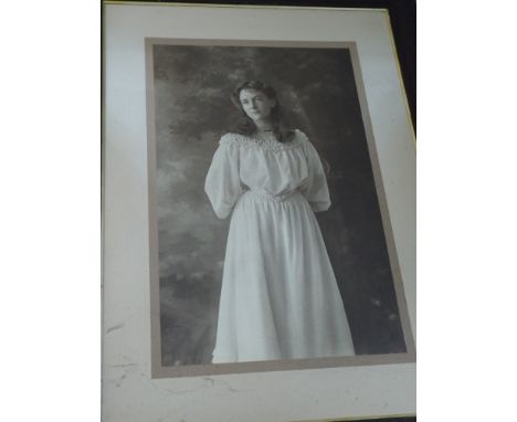 A wall mirror in mahogany frame and a large oak framed print of a young lady 