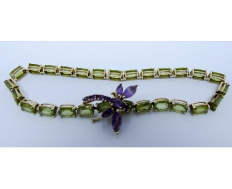 Peridot line bracelet with unusual dragonfly amethyst clasp. Clasp stamped Mexico 9ct, 20 cms long