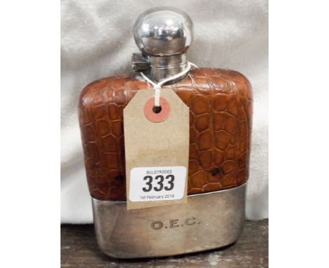 An Edwardian silver plated and leather mounted hip flask with silver collar 