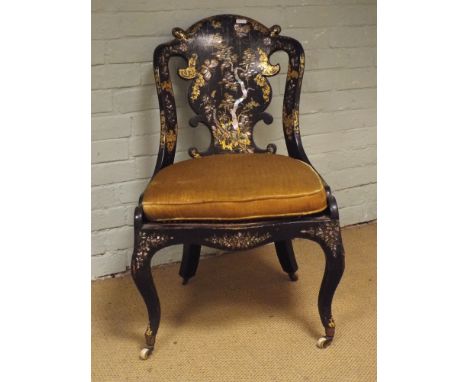 A Victorian black lacquered occasional chair with gilt and mother of pearl decoration and gold upholstered seat