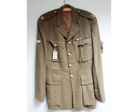 An army khaki tunic to a major in the Royal Tank Regiment complete with medal ribbons and bras buttons 