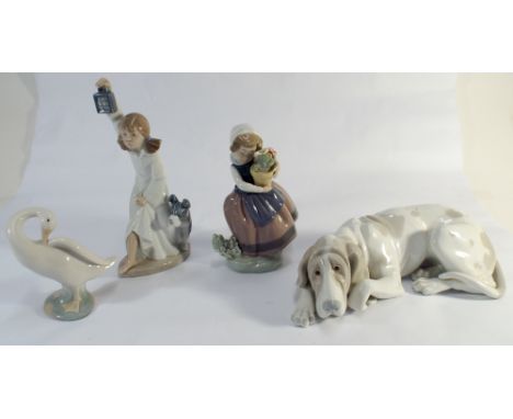 Four pieces of Nao and Lladro porcelain 