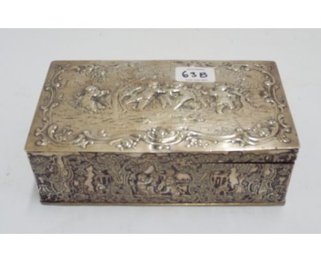Continental white metal rectangular box, with embossed decoration of cherubs playing. Indistinct marks to the base. 20 cms ac