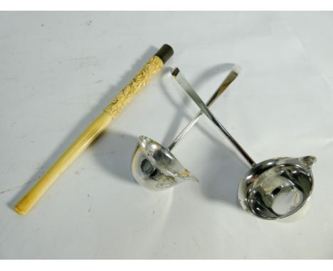 Two hallmarked silver toddy ladles and an antique carved ivory Chinese cigarette holder with white metal mount 