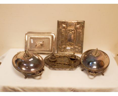 A pair of oval plated entree dishes, one other, decorative panel and a brass desk inkstand 