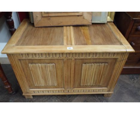 A stripped oak linen fold two panel coffer