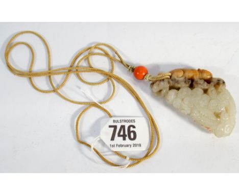 Chinese carved jade pendant carved with a big cat fighting a coiled dragon suspended on a silk cord with coral bead and tiny 
