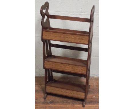 Pair of early 20th century Arts & Crafts book shelves, of three tiers with copper panels inset to one, embossed leather panel