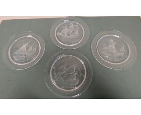 Lalique a set of four cendrier or plates all etched with galleons signed R Lalique France, 22cms diameter in original Lalique