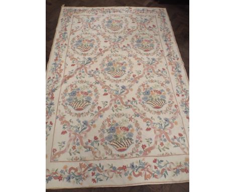 A large cream and floral needlework panel wall hanging or table cover 