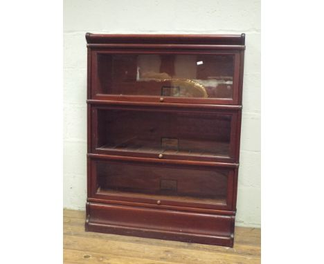 A three section mahogany Globe Wernicke glazed bookcase with a spare lead light panel 87cms wide and 1 meter 5cm high  All do