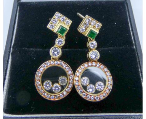 A pair of Chopard Happy Diamonds earrings in 18ct yellow gold with emerald and diamond posts marked