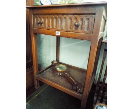 A two tier oak hall table fitted one drawer and a banjo wall barometer 