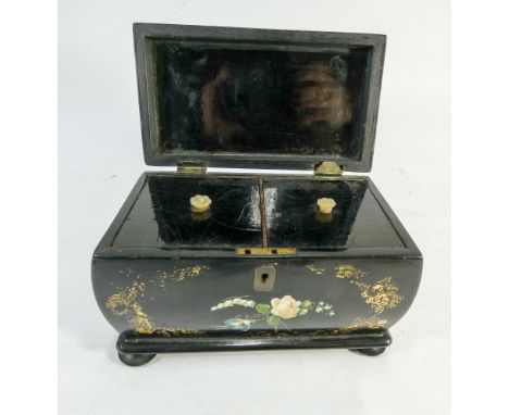 A Victorian black paper mache tea caddy with gilt and floral decoration 18cms across